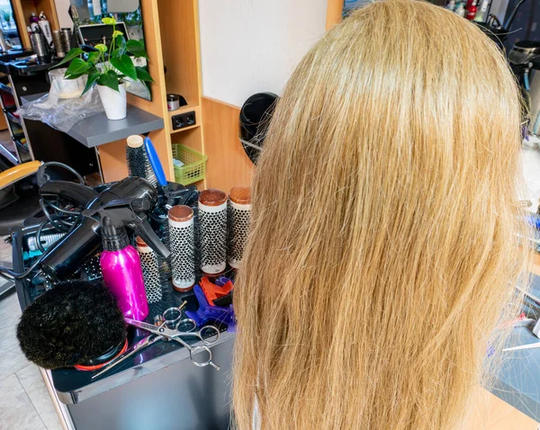 Blond woman in hair salon