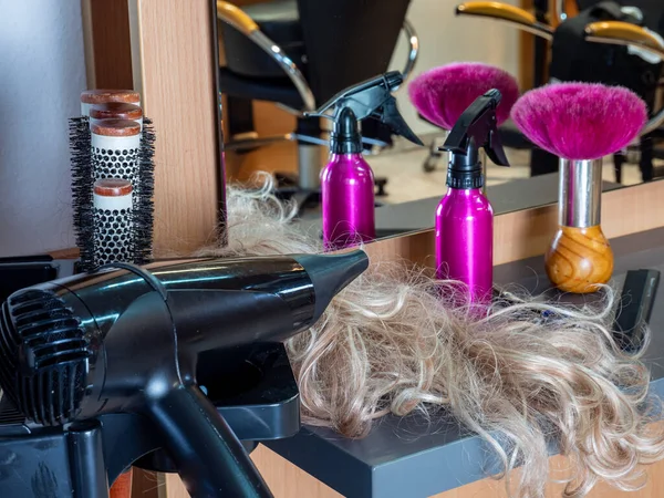Background hairdressing salon with tools and hair dryer