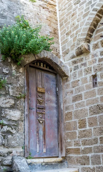 Old wooden door with stairs in Old Jaffa, Israel