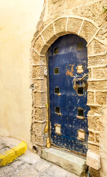 Old metal dark blue door in Old Jaffa, Israel