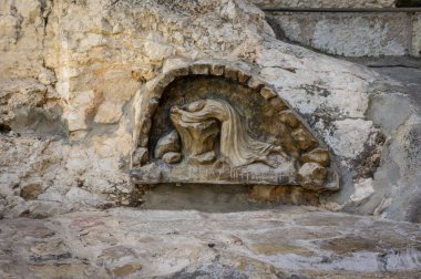 Bas-relief The rock of agony in Church of All Nations. Jerusalem, Israel. Close up. clipart