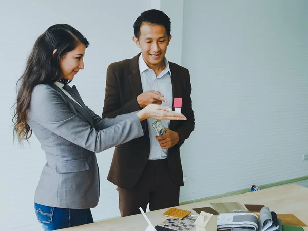 Asian couples, husbands and wives come together to design a house. To live together as a family in the future.