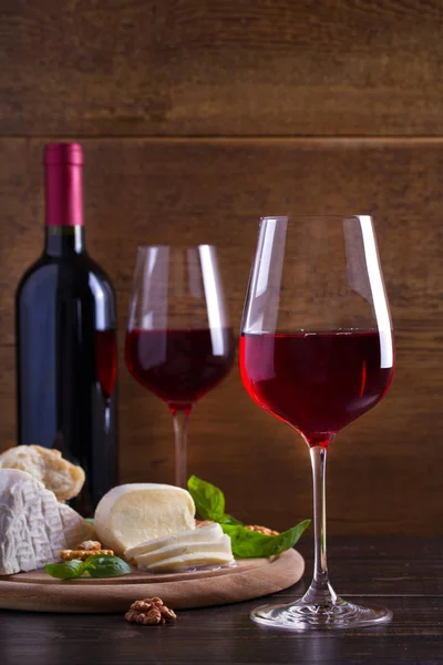 Glasses Wine Cheese Bread Nuts Prosciutto Basil Wine Food Wooden — Stock Photo, Image
