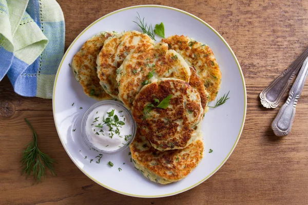 Herb and Cheese Mashed Potato Cakes. Potato Pancakes. Vegetable fritters. View from above, top studio shot