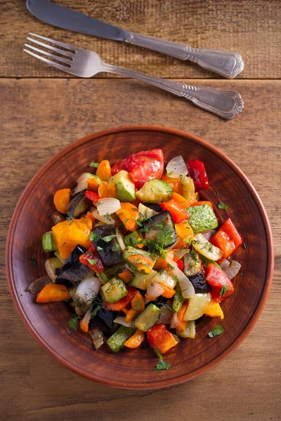 Vegetable stew: eggplant, pepper, tomato, zucchini, carrot and onion. Stewed vegetables salad. overhead, vertical