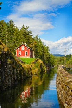 View of the Telemark Canal with old locks - tourist attraction in Skien, Norway clipart