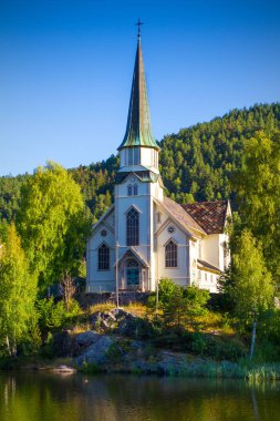 Skotfoss Church - view from the Telemark Canal Skien, Norway clipart