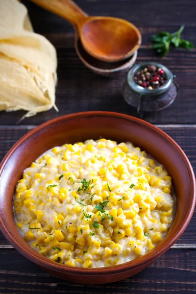 Sweet and creamy corn in bowl. Corn dish.  vertical