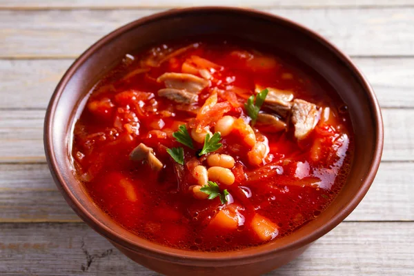 Soup made with vegetables, meat, bean and beet root: borsht, bortsch, borshch, borscht. Traditional dish in Ukraine, Russia, Poland