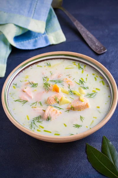 Salmon soup. Creamy  salmon fish soup in bowl. vertical