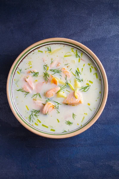Salmon soup. Creamy  salmon fish soup in bowl. overhead, vertical