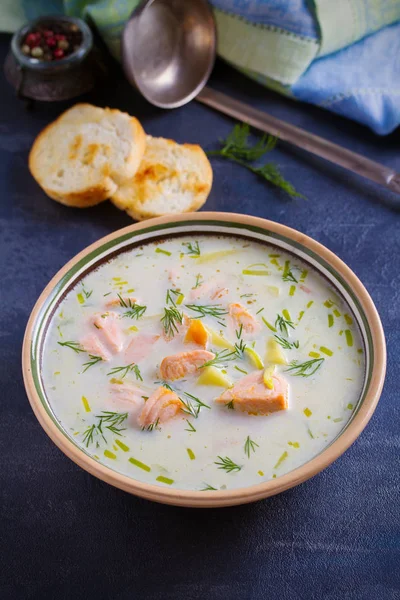 Salmon soup. Creamy  salmon fish soup in bowl. vertical