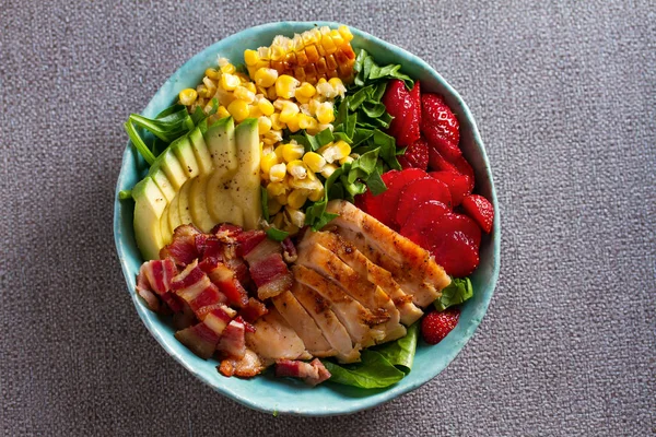 Chicken Cobb Salad. Chicken bacon avocado and sweet corn salad. View from above, top studio shot