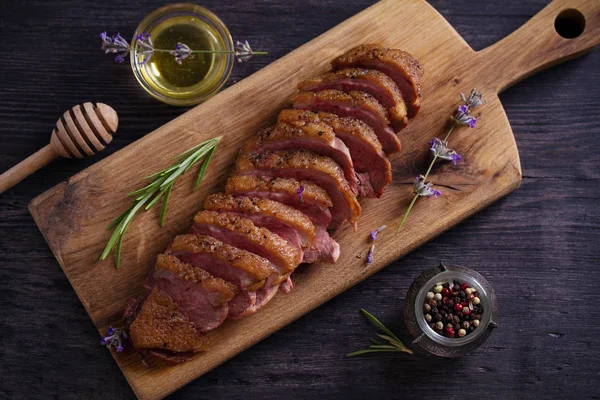 Duck breast on serving board. Duck breast fillet steak