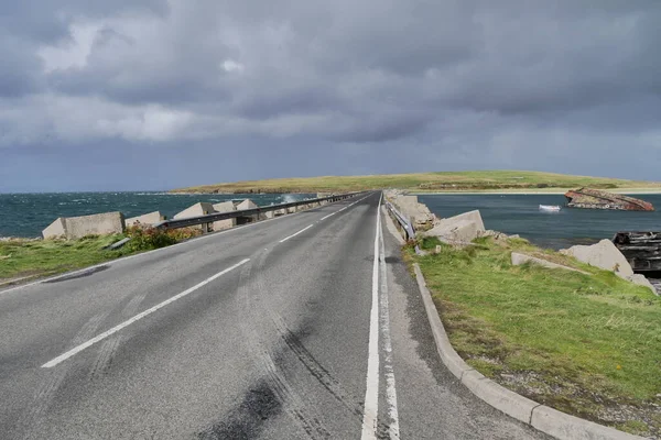 A roadway across a Churchill Barrier in the Orkney Islands in Scotland, UK
