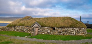 The reconstructed Viking Longhouse near Haroldswick, Unst, Shetland, Scotland, UK clipart