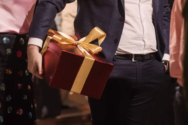 Man Holds His Hands Big Red Box Gift Decorated Yellow Stock Image