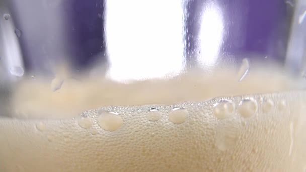 Orange Fruit Beer Splashes Foam Bubbles Slowly Poured Glass Macro — Stock Video
