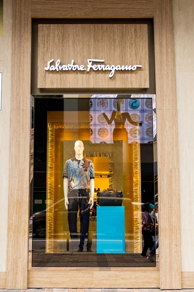 Salvatore Ferragamo brand logo and window display seen in Tsim S — Stock Photo, Image