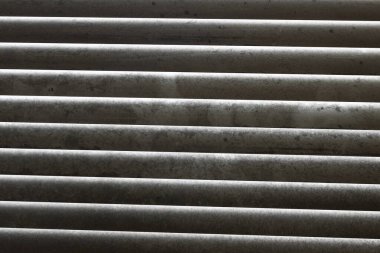 Extremely dirty window blinds in need of cleaning clipart