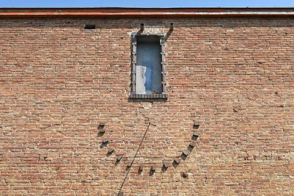 Sun-dial on the brick wall of an old building