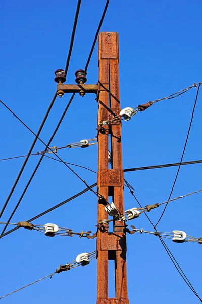 Rusty metal pole of the trolley car