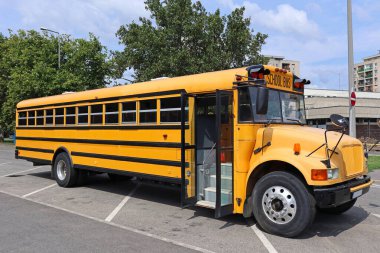 School bus in the parking lot clipart