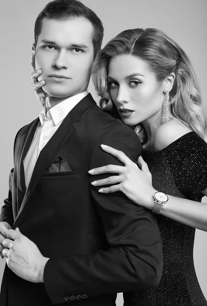 Sensual beautiful young couple dressed in formal clothes