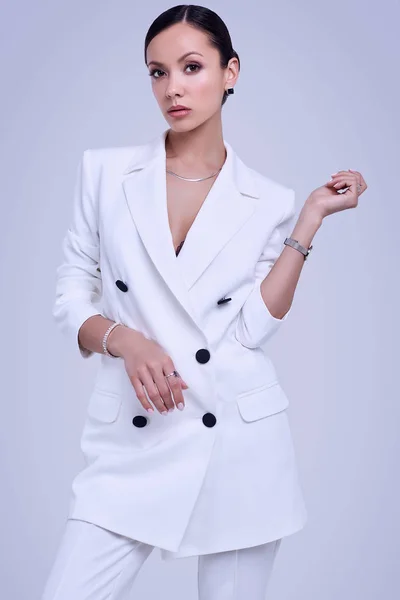 Gorgeous latin women in fashion white suit — Stock Photo, Image