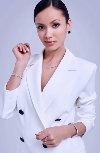 Gorgeous latin women in fashion white suit — Stock Photo, Image