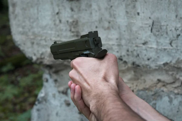 Gun Hand Caucasian Man Brick Wall Rocks Shooter Gun Dark — Stock Photo, Image