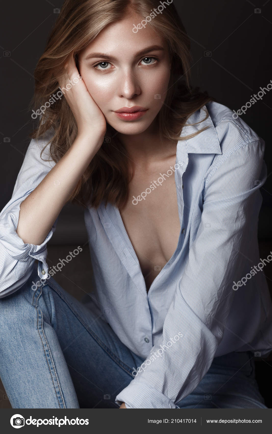 Fashion model with long hair, perfect skin is posing in studio for glamour  test photo shoot showing different poses Stock Photo by ©kobrin-photo  210417014