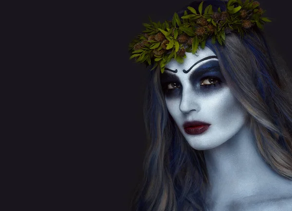 Portrait of a horrible scary Corpse Bride in wreath with dead flowers, halloween makeup — Stock Photo, Image