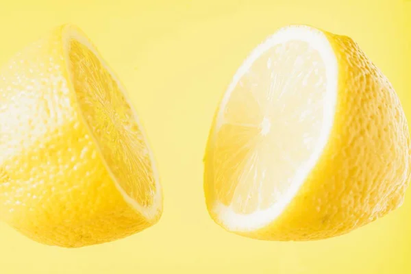 Sliced Lemon Floating Yellow Background — Stock Photo, Image