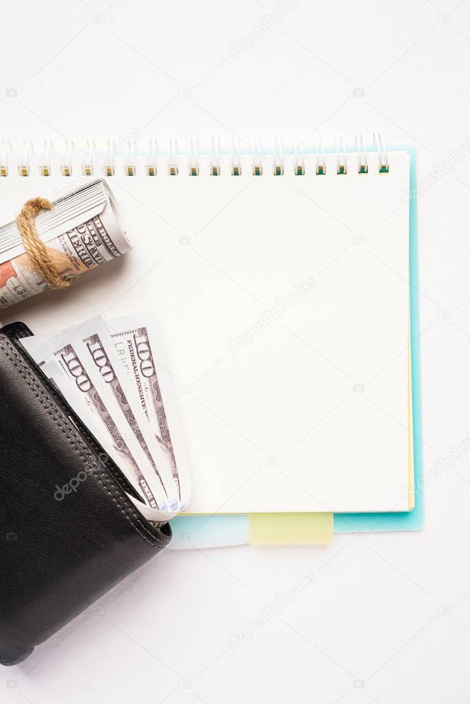 Empty notebook with wallets on white background. Copy space for text