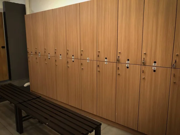 the interior of a changing/locker room of a gymnasium.