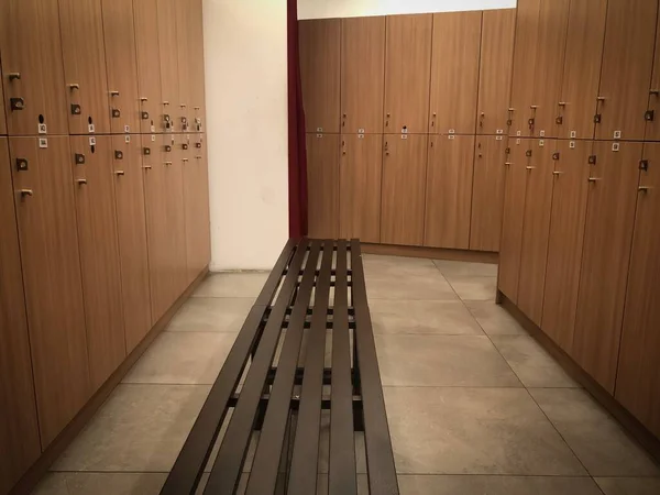 the interior of a changing/locker room of a gymnasium.