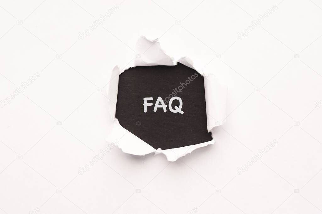 FAQ wordings on a torn paper background