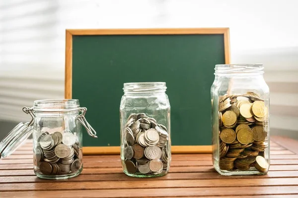 Saving Concept Coins Glass Containers Chalkboard Copy Space — Stock Photo, Image