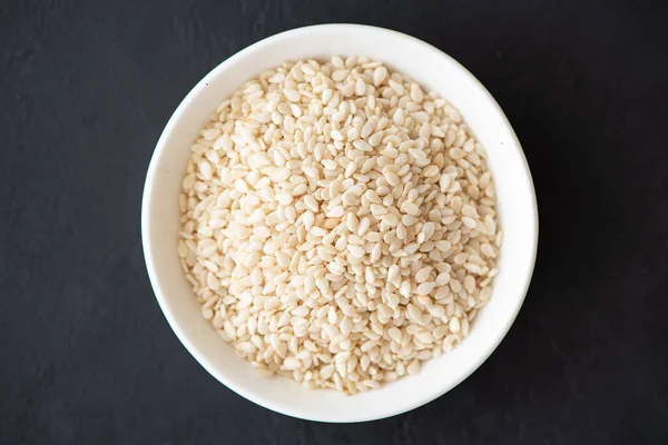 Spices for cooking - white sesame seeds close-up — Stock Photo, Image