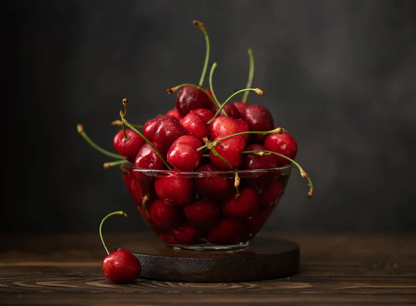 ripe red cherries in a glass bowl