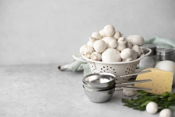 Ingredients for classic julienne - mushrooms, onions, cheese, sour cream on a white table — Stock Image Ingredients Classic Julienne Mushrooms Onions Cheese Sour Cream White Table Stock Photo