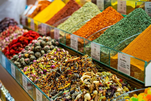 Various bright colored powder spices and fruit herbal tea and dried vegetables on market in Istanbul, Turkey.
