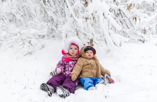 Brother Sitting His Little Sister Snow Horizontal Portrait — Stock Photo, Image