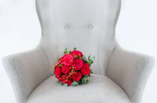 Wedding flowers on armchair isolated on background