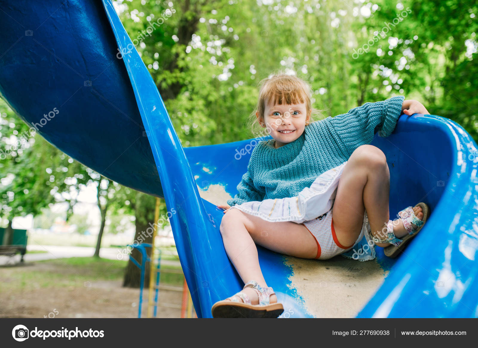 Baby Girl Plays On The Playground Stock Photo Avk78 277690938 baby-girl-plays-on-the-playground-stock-photo-avk78-277690938