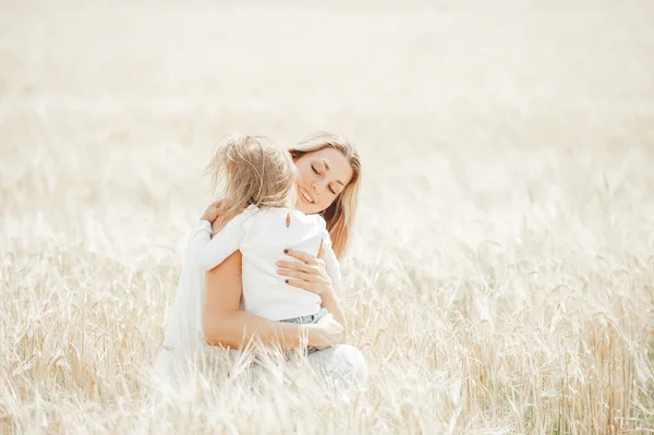 Sincere hugs of mother and daughter outdoors. Mother's day celebration concept — Stock Photo, Image