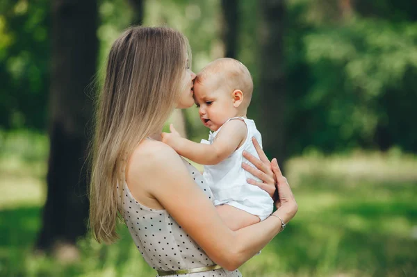 Mother kissing her baby child. — Stock Photo, Image