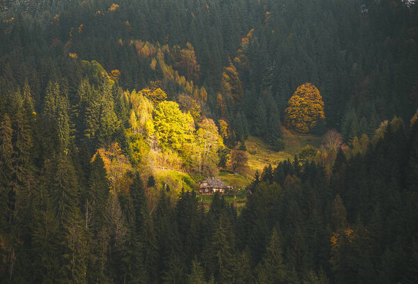 Old wooden hut on background of beautiful mountain landscape. 