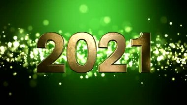Noel 'in video animasyonu altın ışık parçacıkları yeşil zemin üzerine parlıyor ve 2021 rakamları yeni yılı temsil ediyor - tatil kavramını.